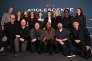 (L-R) guest, Jack Thorne, Christine Tremarco, Mark Herbert, Anne Neville, Jo Hartley, Stephen Graham, Amelie Pease, Ashley Walters, Owen Cooper, Hannah Walters, Director Philip Barantini, guest, Robbie O'Neill and guest attend the "Adolescence" Special Screening at BAFTA on March 12, 2025 in London, England. | Image via: Getty